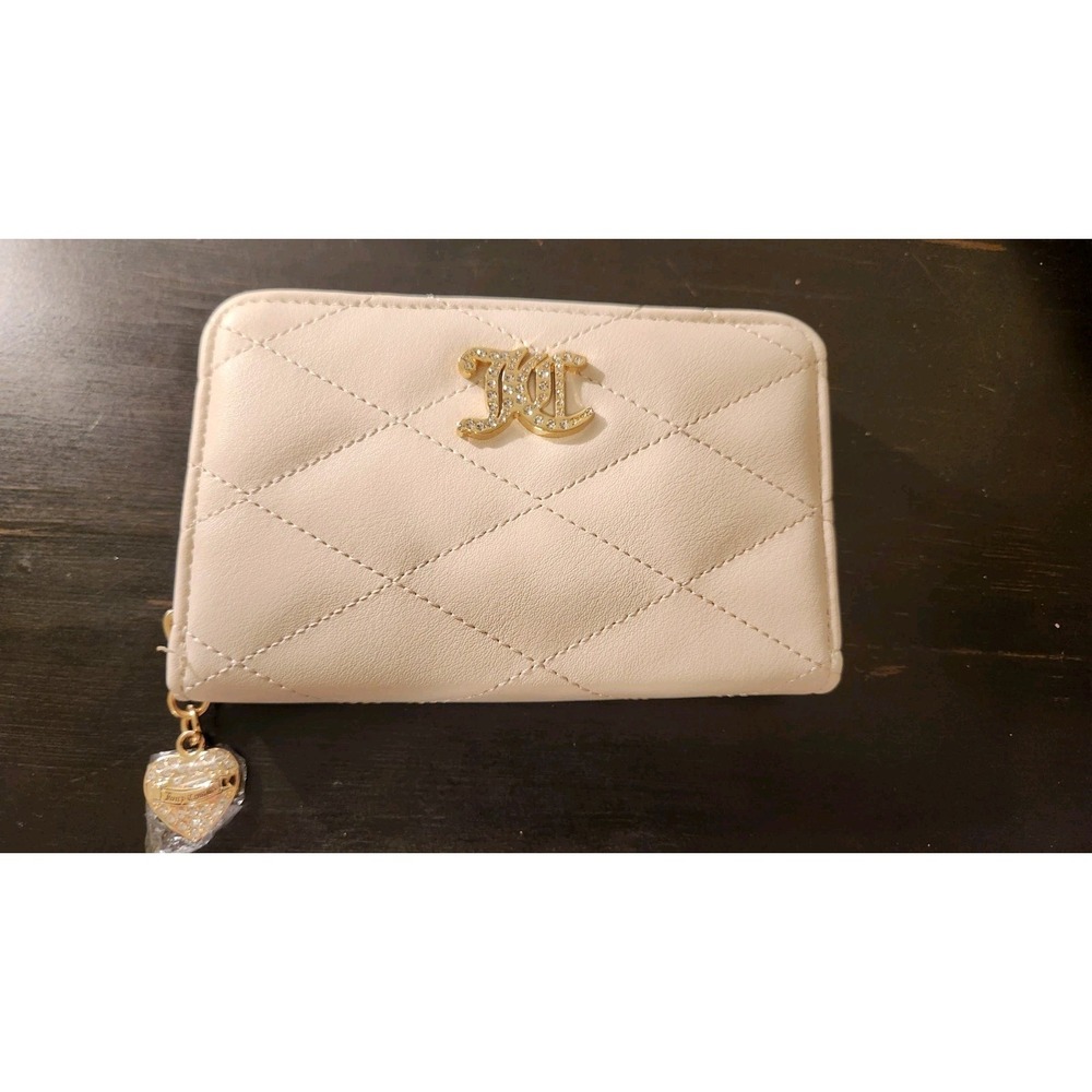 Juicy couture wallet NWT and plastic seal on charm